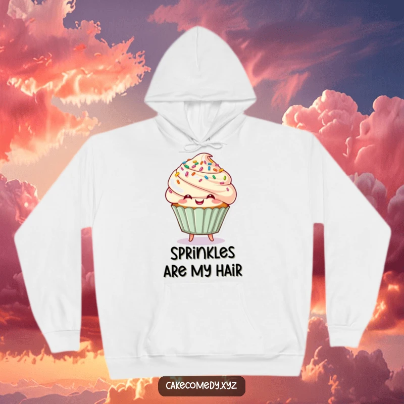 Funny cupcake character with sprinkle hair bouncing playfully on a hoodie, a cozy and humorous garment for sweet people.